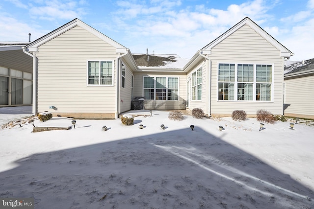 view of snow covered house