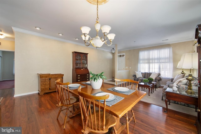 dining room with a notable chandelier, crown molding, and dark wood-type flooring