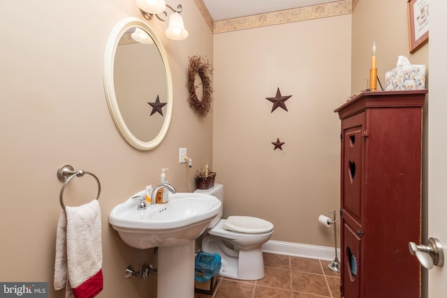 bathroom featuring tile patterned flooring and toilet