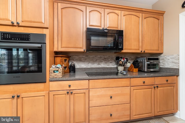 kitchen with decorative backsplash and black appliances