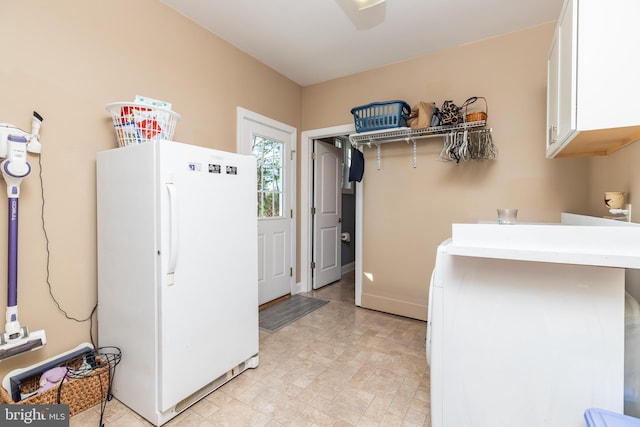 clothes washing area with washer / dryer