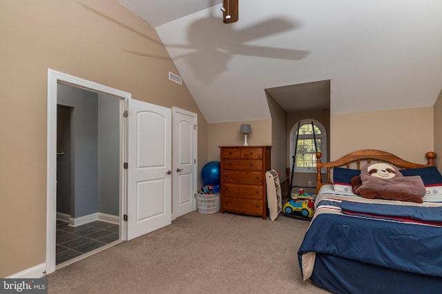 bedroom with carpet flooring, ceiling fan, and lofted ceiling