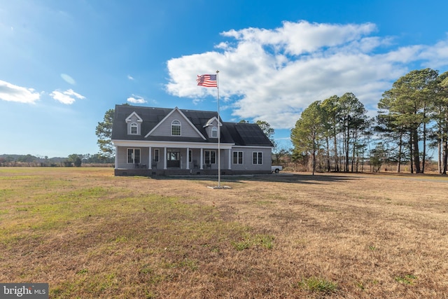 view of front of property with solar panels, a porch, and a front lawn