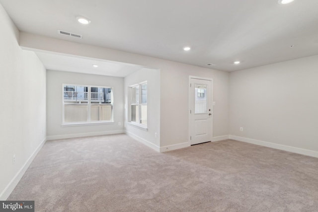 view of carpeted foyer entrance