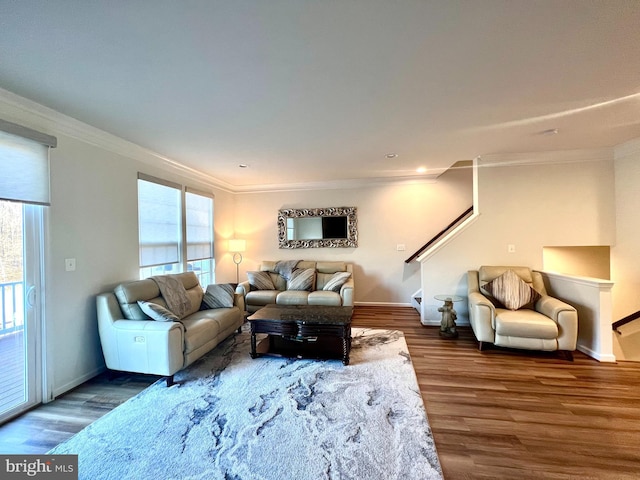 living room with ornamental molding and dark hardwood / wood-style floors