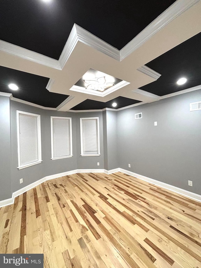 unfurnished room with ornamental molding, light hardwood / wood-style flooring, and coffered ceiling