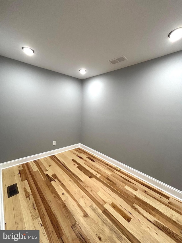 unfurnished room featuring hardwood / wood-style floors