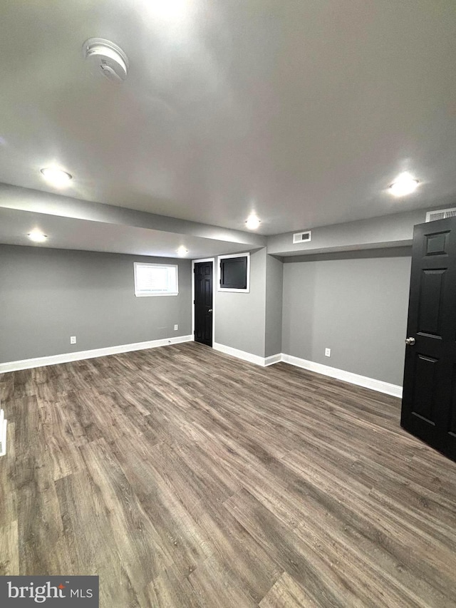 basement with hardwood / wood-style flooring