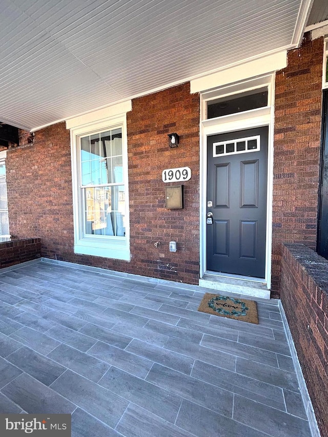 entrance to property with a porch