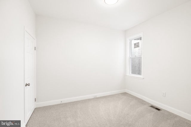 carpeted empty room featuring plenty of natural light