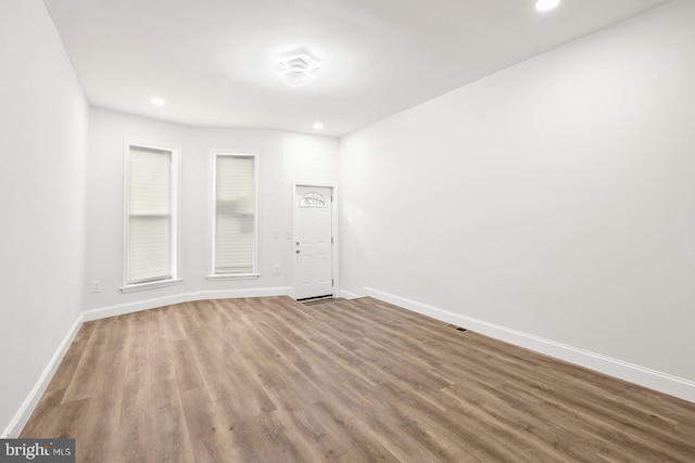 spare room with hardwood / wood-style flooring