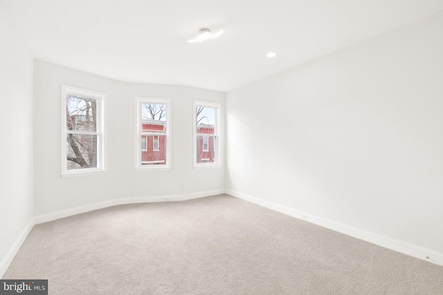 unfurnished room featuring carpet and a healthy amount of sunlight