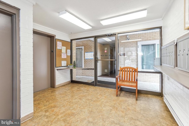 sunroom featuring a mail area and elevator