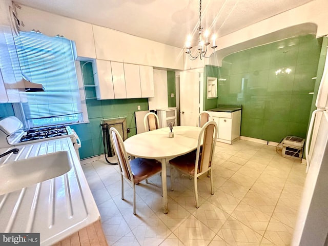 dining area featuring a notable chandelier