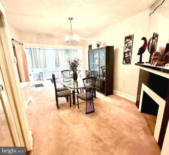 carpeted dining room with a notable chandelier