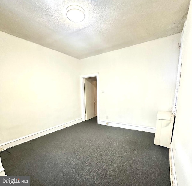 empty room featuring a textured ceiling