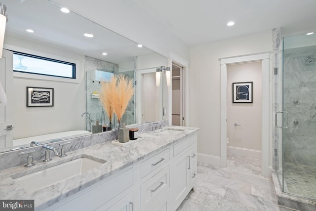 bathroom with recessed lighting, marble finish floor, a sink, and baseboards