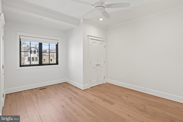 unfurnished bedroom with light wood finished floors, baseboards, crown molding, and recessed lighting