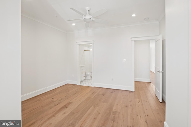 empty room with baseboards, a ceiling fan, light wood-style flooring, and crown molding