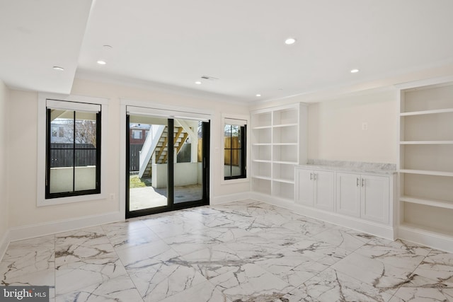 spare room featuring built in shelves, recessed lighting, baseboards, marble finish floor, and ornamental molding