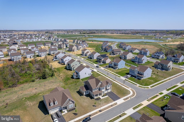 aerial view with a residential view and a water view