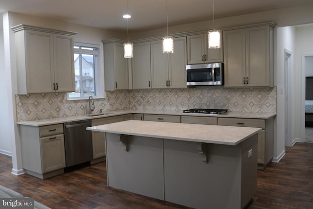 kitchen featuring gray cabinetry, dark hardwood / wood-style floors, and appliances with stainless steel finishes