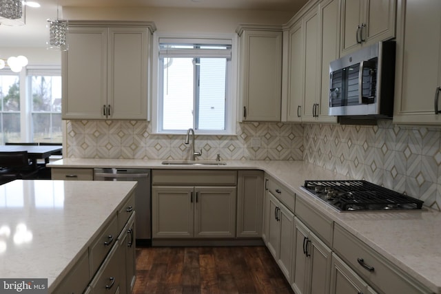 kitchen with decorative backsplash, dark hardwood / wood-style flooring, stainless steel appliances, and sink