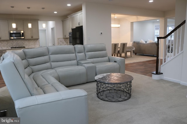 living room featuring light carpet