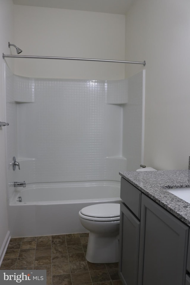 full bathroom with vanity, toilet, and washtub / shower combination