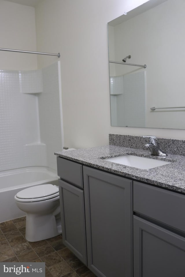 full bathroom featuring vanity, toilet, and tub / shower combination