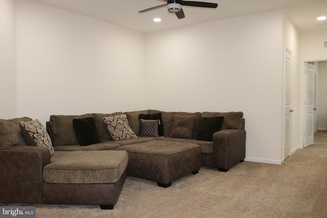 living room featuring ceiling fan and light carpet