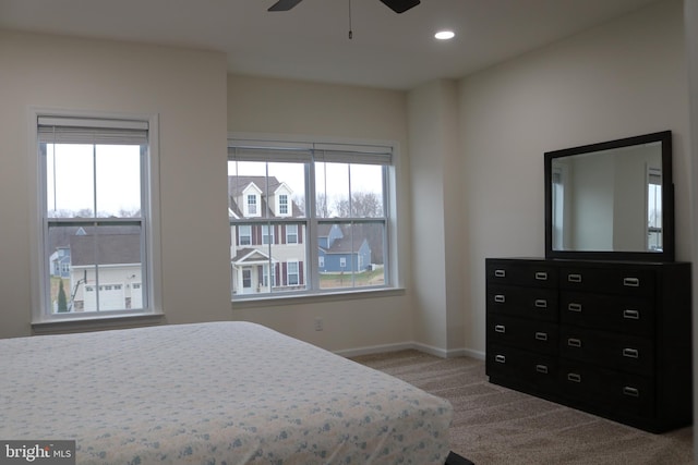 bedroom with ceiling fan and carpet floors