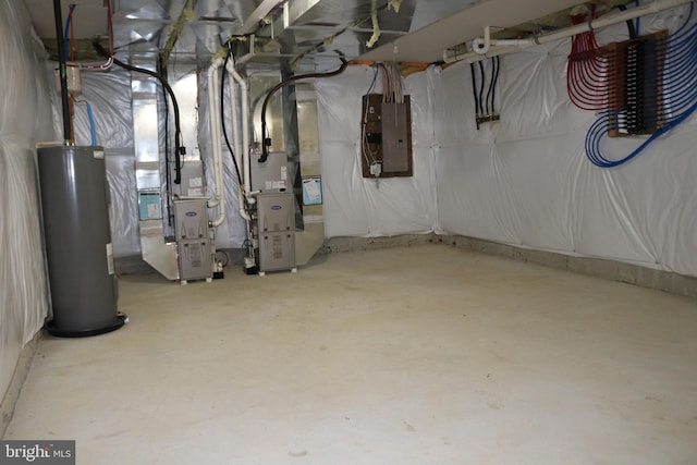 basement with electric panel, heating unit, and water heater