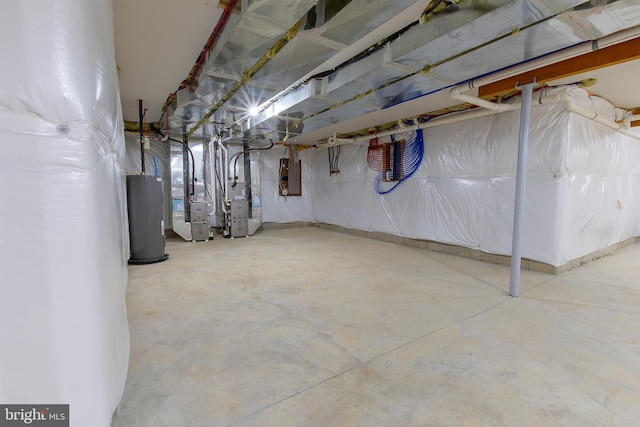 unfinished basement with water heater, heating unit, and electric panel