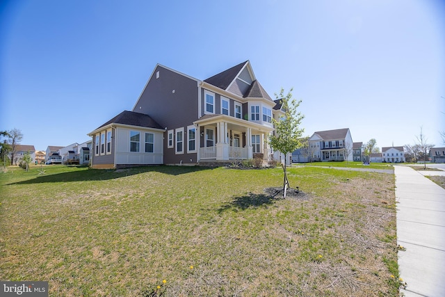view of front facade featuring a porch and a front yard