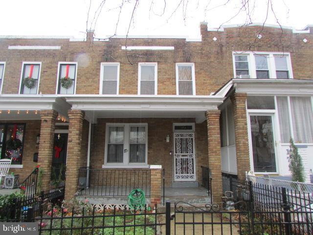 view of property with covered porch