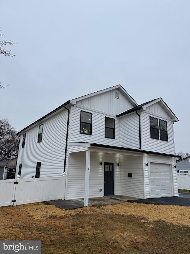 view of front of home featuring a porch and a garage