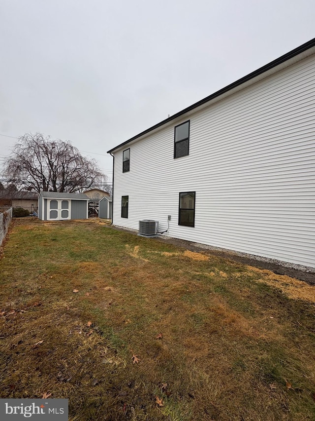 view of home's exterior featuring a yard and cooling unit