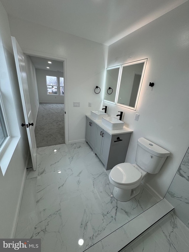 bathroom with vanity and toilet