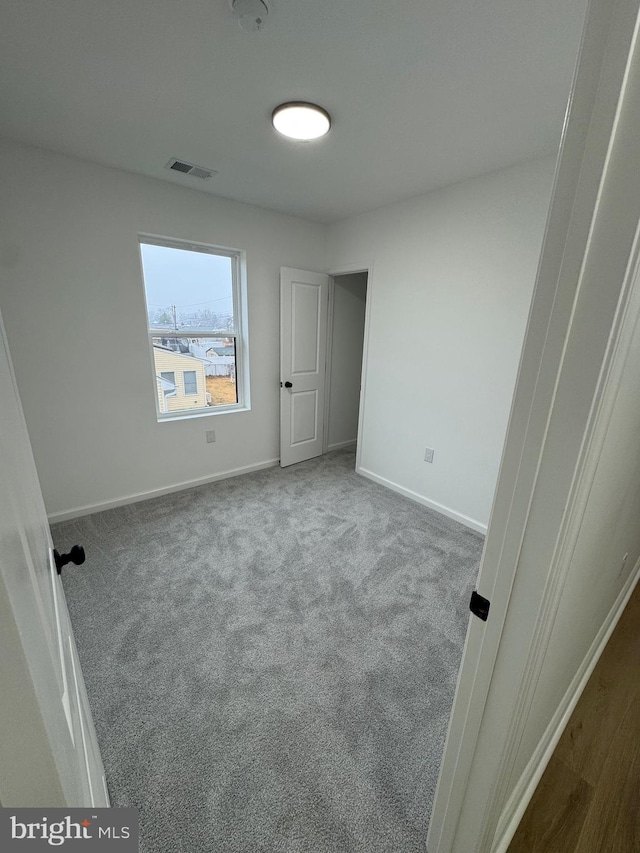 unfurnished bedroom with carpet