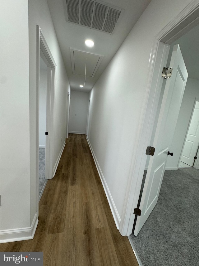 hall with dark hardwood / wood-style flooring