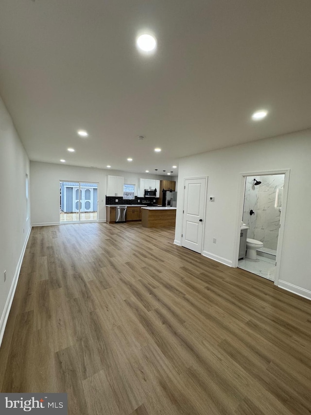 unfurnished living room with hardwood / wood-style floors