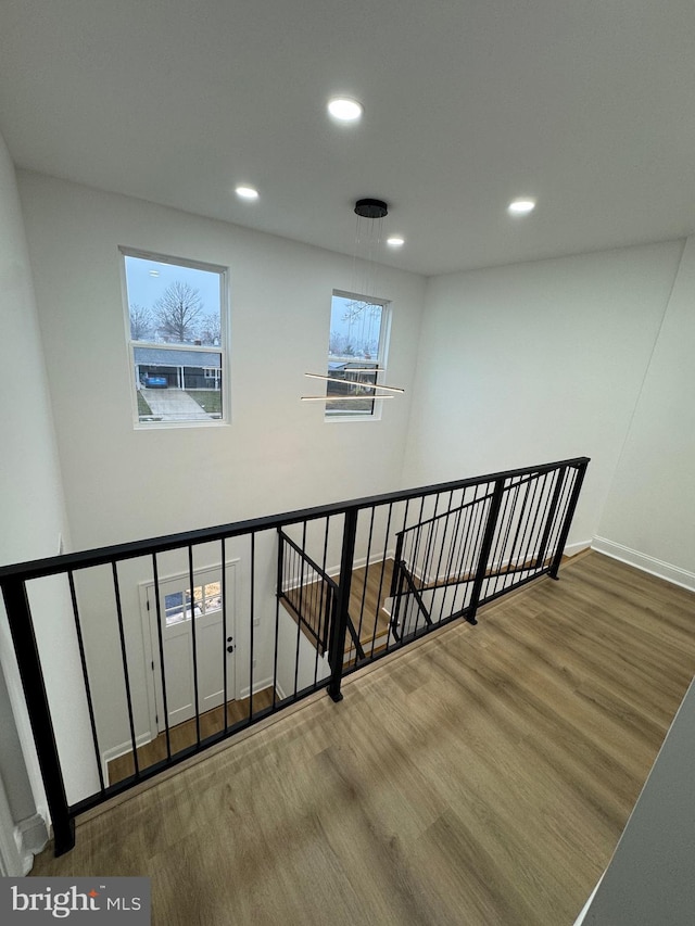 stairs with wood-type flooring