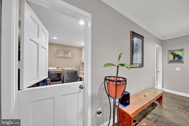 interior space with washer and dryer and ornamental molding