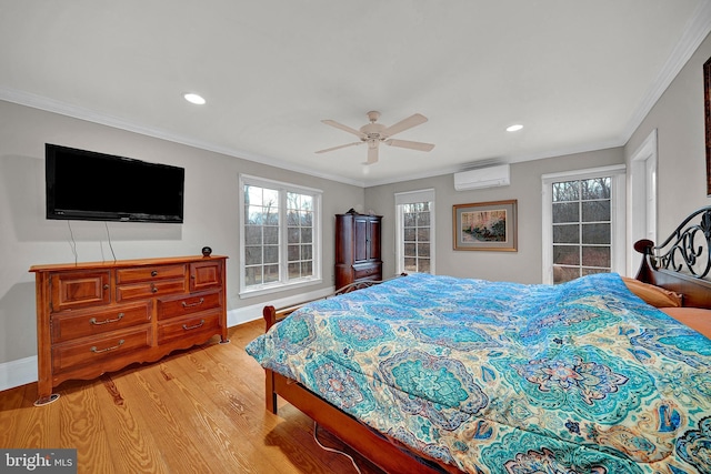 bedroom with ceiling fan, crown molding, light hardwood / wood-style flooring, and a wall mounted AC