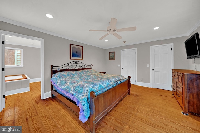 bedroom featuring ceiling fan, crown molding, and light hardwood / wood-style flooring