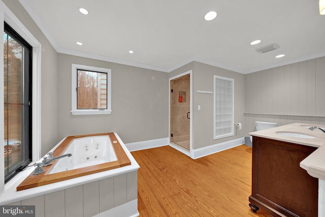 bathroom featuring wood-type flooring, vanity, shower with separate bathtub, and ornamental molding