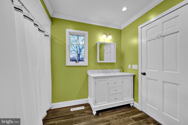 bathroom with vanity and ornamental molding