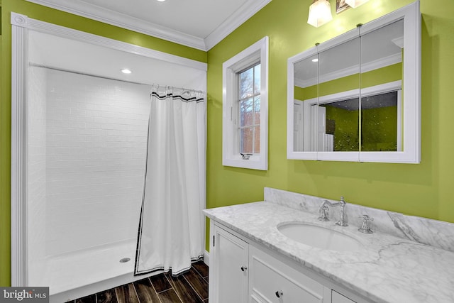 bathroom featuring curtained shower, crown molding, and vanity