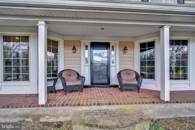 property entrance featuring covered porch